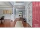 Bright foyer with hardwood floors, wainscoting and a view of the staircase at 4117 Bright Rd, Charlotte, NC 28214