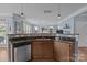 Open concept kitchen area with sleek countertops and stainless steel dishwasher at 4117 Bright Rd, Charlotte, NC 28214