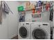 Convenient laundry room with modern washer and dryer, shelving for storage, and laundry supplies at 4117 Bright Rd, Charlotte, NC 28214