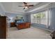 Serene main bedroom with a tray ceiling, carpeted floors, and a large window for natural light at 4117 Bright Rd, Charlotte, NC 28214