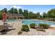 Community pool featuring a splash pad, kiddie pool, seating, and sun umbrellas at 4117 Bright Rd, Charlotte, NC 28214