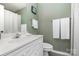 Bathroom featuring a white vanity with a solid surface countertop, toilet, and a shower curtain at 4124 Melrose Club Dr, Matthews, NC 28105