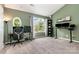 Home office features carpet flooring, a built-in bookcase, a large window, and a comfortable chair at 4124 Melrose Club Dr, Matthews, NC 28105