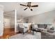 Spacious living room showcasing hardwood floors, a comfortable gray sofa, and an open layout at 4124 Melrose Club Dr, Matthews, NC 28105