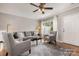 Inviting living room featuring neutral tones, a plush sofa, and a bright window at 4124 Melrose Club Dr, Matthews, NC 28105