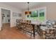 Charming breakfast nook with casual dining set, large windows, and views of the lush backyard at 4201 Quail Hunt Ln, Charlotte, NC 28226