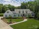 Charming exterior view of a home with manicured lawn and detailed landscaping at 4201 Quail Hunt Ln, Charlotte, NC 28226