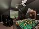 Spacious game room features a foosball table, comfortable seating and a modern ceiling fan at 4201 Quail Hunt Ln, Charlotte, NC 28226