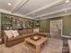 Bright living room with a wet bar, wood beams, and open layout at 4201 Quail Hunt Ln, Charlotte, NC 28226