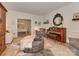 Inviting living room with stylish decor, including a piano, plush seating, and decorative ottoman at 4201 Quail Hunt Ln, Charlotte, NC 28226