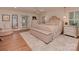 Serene main bedroom boasts wood floors, shutters, sitting area, and neutral decor at 4201 Quail Hunt Ln, Charlotte, NC 28226
