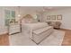 Comfortable main bedroom features wood floors, shutters, sitting area, and soft decor at 4201 Quail Hunt Ln, Charlotte, NC 28226