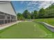 Backyard with an artificial turf putting green at 4201 Quail Hunt Ln, Charlotte, NC 28226
