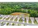 Beautiful aerial view of a neighborhood featuring a pond and tree-lined street at 449 Misty Law Ln, Clover, SC 29710