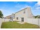 Spacious backyard with white fence, playset, green grass, and patio at 449 Misty Law Ln, Clover, SC 29710