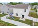 Aerial view of a fenced backyard with a playset, perfect for outdoor activities and privacy at 449 Misty Law Ln, Clover, SC 29710