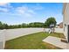 Well-maintained fenced backyard with lush green grass and a playset, perfect for outdoor fun at 449 Misty Law Ln, Clover, SC 29710