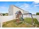 Fenced backyard featuring a playset and well-maintained lawn, ideal for Gathering activities at 449 Misty Law Ln, Clover, SC 29710