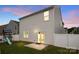 The exterior view of the back of the house with a playground and a sliding glass door at 449 Misty Law Ln, Clover, SC 29710