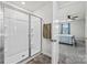 Bathroom showcases a glass shower enclosure with a towel hanging, and view into the bedroom at 449 Misty Law Ln, Clover, SC 29710