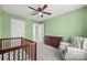 This Bedroom features a crib, rocking chair, dresser, closet and connecting doorway at 449 Misty Law Ln, Clover, SC 29710