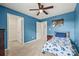 Blue bedroom with a bed, closet and a dinosaur theme at 449 Misty Law Ln, Clover, SC 29710