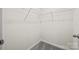Walk-in closet with white wire shelving and gray carpeting at 449 Misty Law Ln, Clover, SC 29710