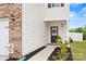 Home exterior features a brick accent wall and a charming front door with a decorative wreath at 449 Misty Law Ln, Clover, SC 29710