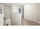 Upstairs hallway with carpet flooring leading to bedrooms and bathrooms at 449 Misty Law Ln, Clover, SC 29710
