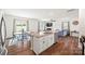 Open floor plan featuring an island, dining area, and living room with fireplace at 449 Misty Law Ln, Clover, SC 29710