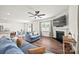 Bright living room with hardwood floors, a fireplace, and an open view to the kitchen and dining area at 449 Misty Law Ln, Clover, SC 29710