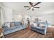 Open-concept living room and kitchen area with hardwood floors and comfortable seating at 449 Misty Law Ln, Clover, SC 29710