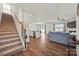 Open-concept living room with hardwood floors and staircase leading to the second floor at 449 Misty Law Ln, Clover, SC 29710