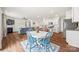 Bright, open-concept living space featuring a cozy fireplace and adjacent dining area at 449 Misty Law Ln, Clover, SC 29710