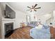 Spacious living room featuring a fireplace, hardwood floors, and comfortable blue sofas at 449 Misty Law Ln, Clover, SC 29710