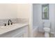 Bright bathroom featuring a marble countertop and tile backsplash at 4648 Rifle Range Rd, Conover, NC 28613