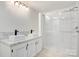 Modern bathroom featuring double sinks, a walk-in shower, and natural light at 4648 Rifle Range Rd, Conover, NC 28613