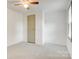 Comfortable bedroom featuring neutral carpet and a closet at 4648 Rifle Range Rd, Conover, NC 28613