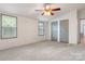 Cozy bedroom featuring neutral carpet and gray closets at 4648 Rifle Range Rd, Conover, NC 28613