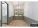Dining area featuring tile floors, neutral walls, chandelier lighting and bright windows at 4648 Rifle Range Rd, Conover, NC 28613