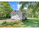 Detached two-car garage with an overhead door and a side entry door at 4648 Rifle Range Rd, Conover, NC 28613