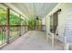 Spacious covered porch with ceiling fan, offering an outdoor relaxation area at 4648 Rifle Range Rd, Conover, NC 28613