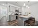Stylish kitchen with stainless steel appliances, granite countertops, and island with seating at 4750 Lakeview N Rd # 18, Charlotte, NC 28216