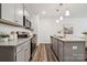 Modern kitchen with stainless steel appliances, granite countertops, and ample cabinet space at 4750 Lakeview N Rd # 18, Charlotte, NC 28216