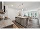 Modern kitchen with granite countertops, stainless steel appliances, and open layout to the living room at 4750 Lakeview N Rd # 18, Charlotte, NC 28216