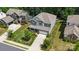 Overhead view of a gray two-story home, showcasing the driveway and lawn at 5088 Watersail Way, Clover, SC 29710