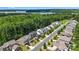 An aerial view shows the neighborhood, nearby lake and surrounding trees at 5088 Watersail Way, Clover, SC 29710
