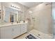 Modern bathroom features a glass enclosed shower, single sink vanity, and neutral tile floors at 5088 Watersail Way, Clover, SC 29710