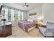 Cozy bedroom featuring carpet, windows, and a modern ceiling fan at 5088 Watersail Way, Clover, SC 29710