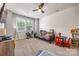 Bright playroom with a futon, a window that lets in lots of natural light, and toys at 5088 Watersail Way, Clover, SC 29710